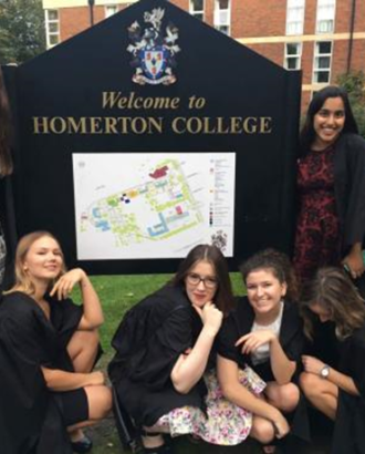 Students posing with the Homerton College sign 